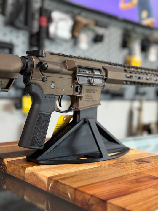 AR15 chambered in 300 blackout on a table mounted stand.